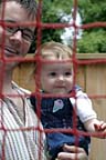 Me and Dad looking at Mom inside the bouncy castle