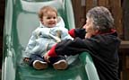 Grandma helping me down the slide